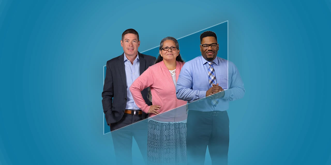 Three Nexus Associates standing in the outline of the Nexus logo