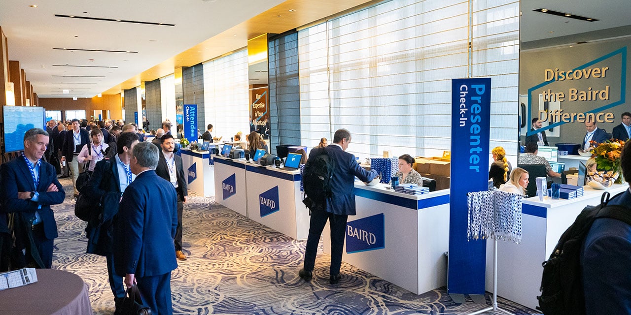 Attendees in the check-in area of a Nexus Conference