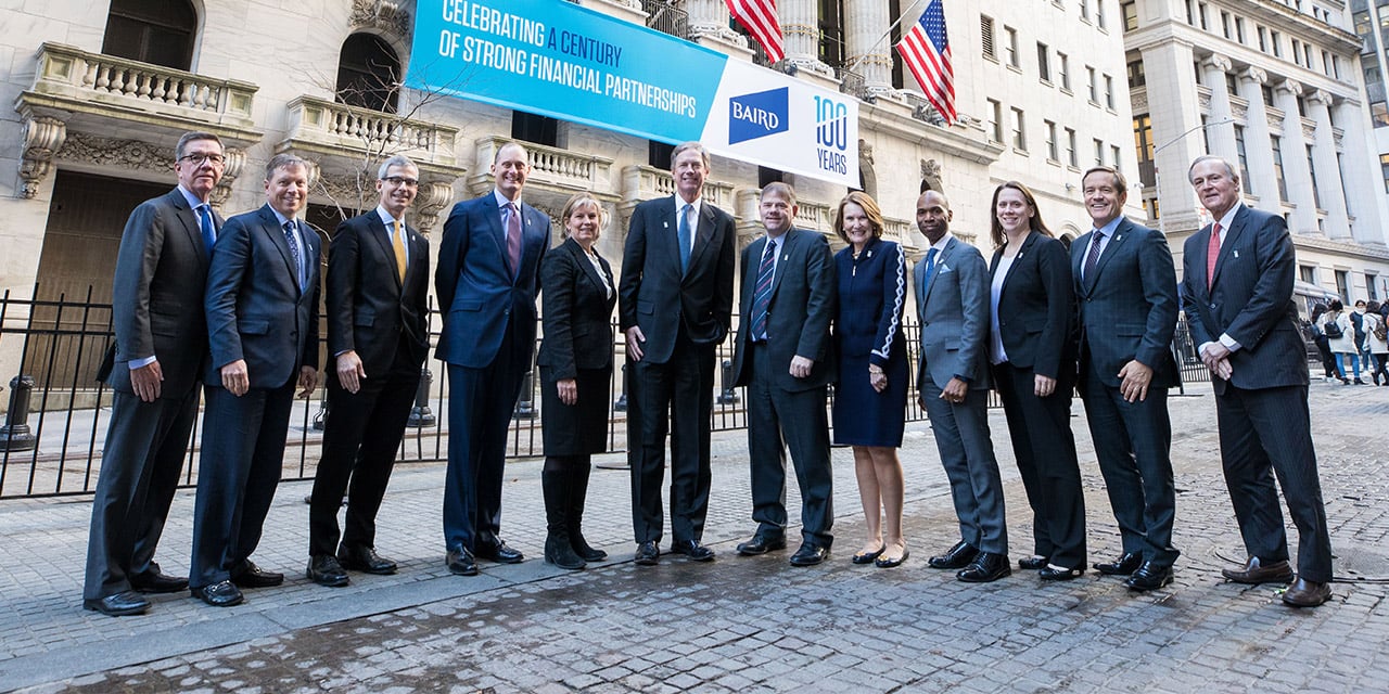  Nexus Executive Committee standing in front of the New York Stock Exchange building.