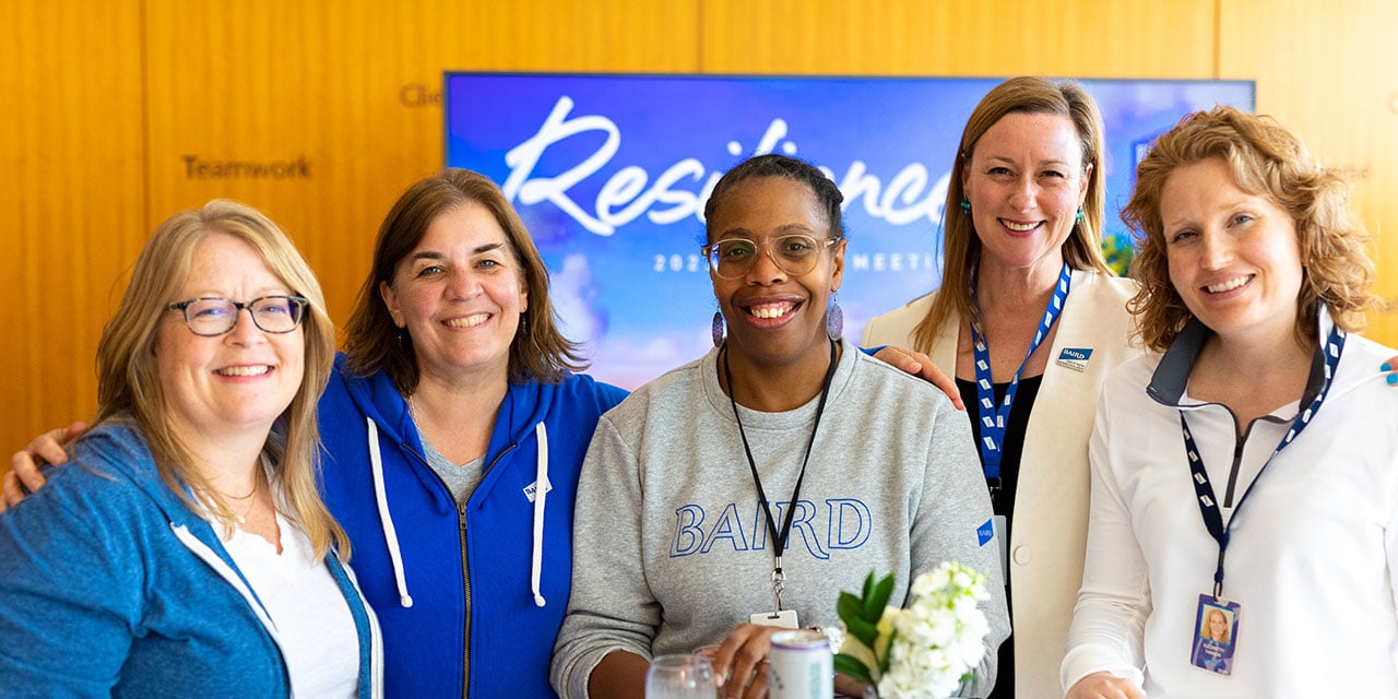 Four Nexus Associates posting for a group photo.
