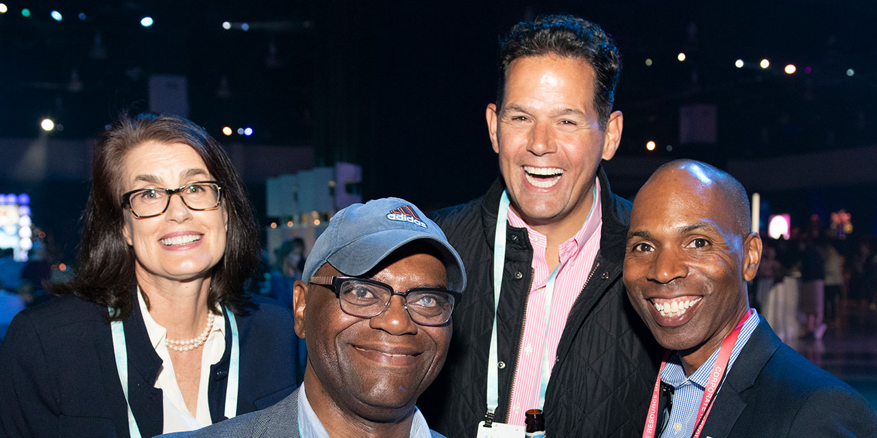 Four Nexus Associates posting together at Nexus event.